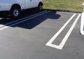 Empty Parking Spot Between Two Cars in a Parking Lot 3 Royalty Free Stock Photo